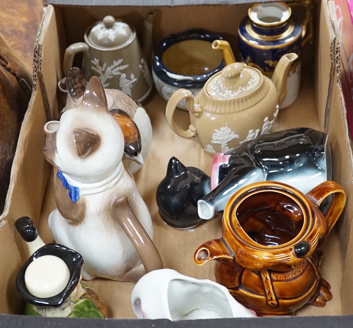 A selection of novelty, and other, teapots